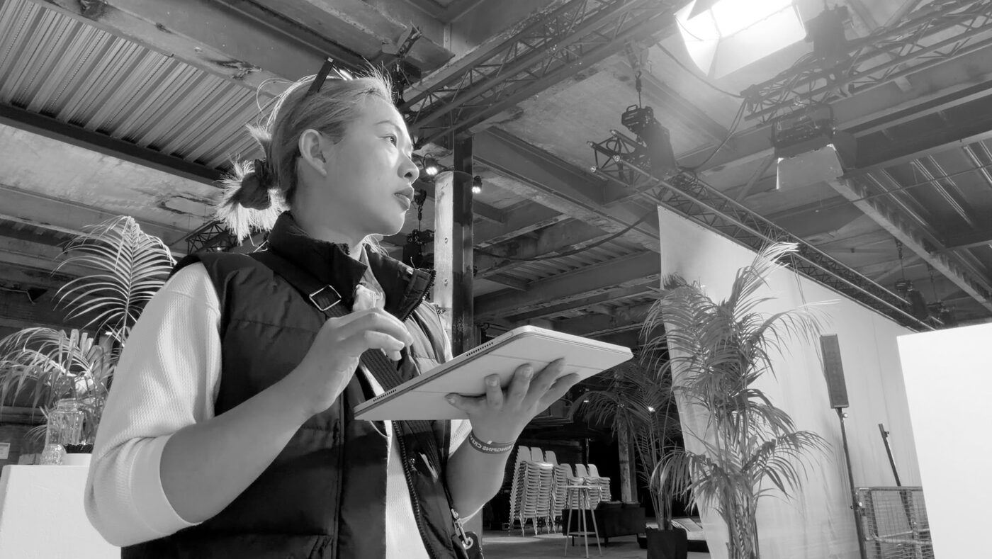 Una Zhu directing trade show content on site at Sugar Factory Amsterdam