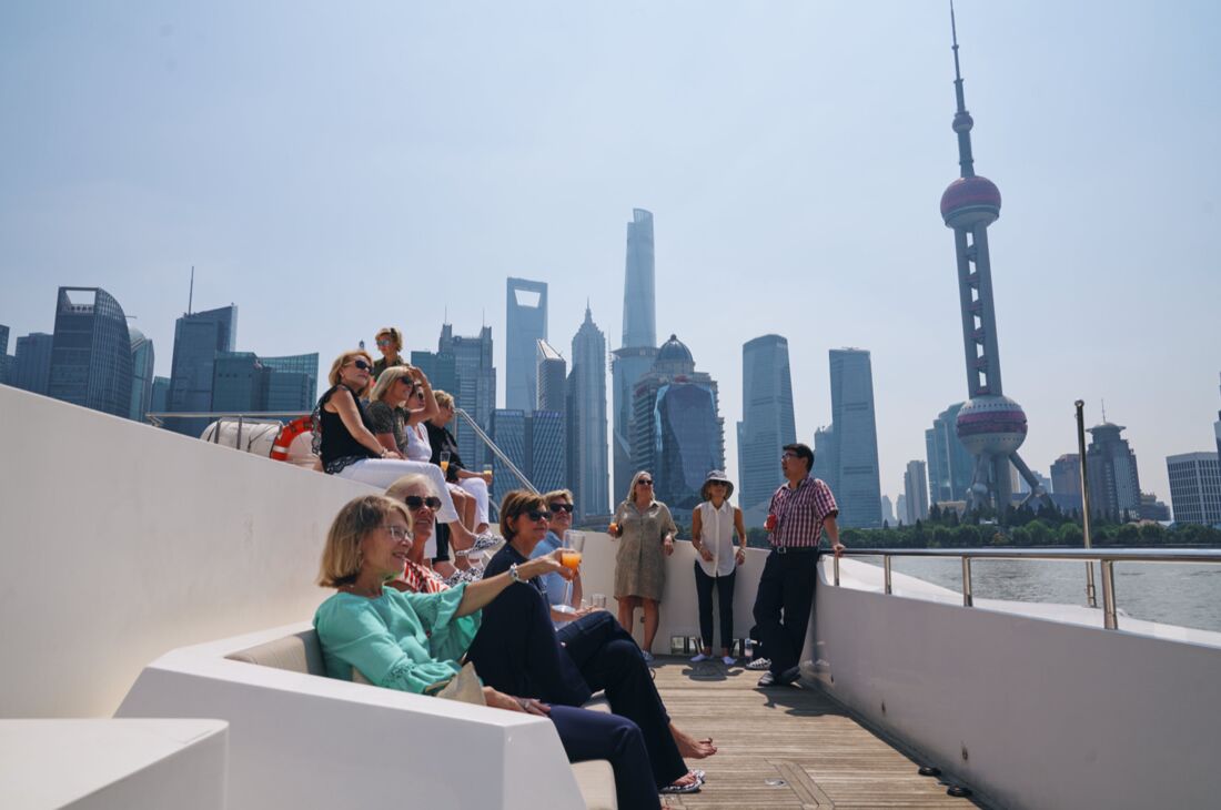 Shanghai VIP event photographer coverage of guests at a waterside event with the Pudong skyline behind